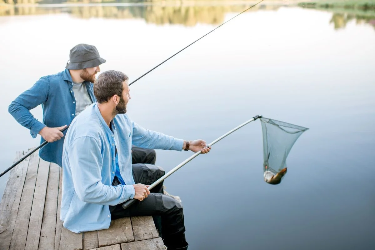 men-catching-fish-on-the-lake-2023-11-27-05-22-32-utc